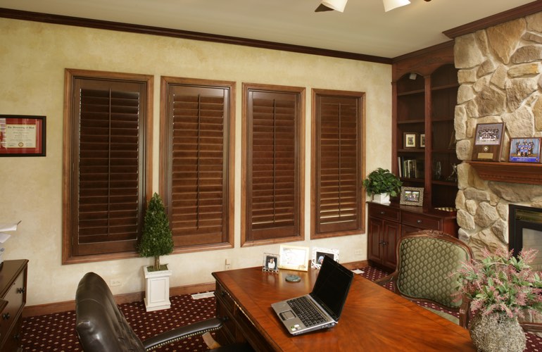 Wooden plantation shutters in a Hartford home office